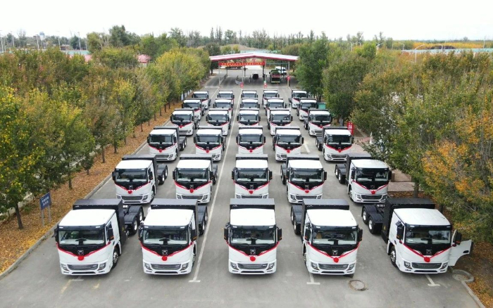 脱碳“换”绿进行时！九游娱乐新能源重卡批量交付西北